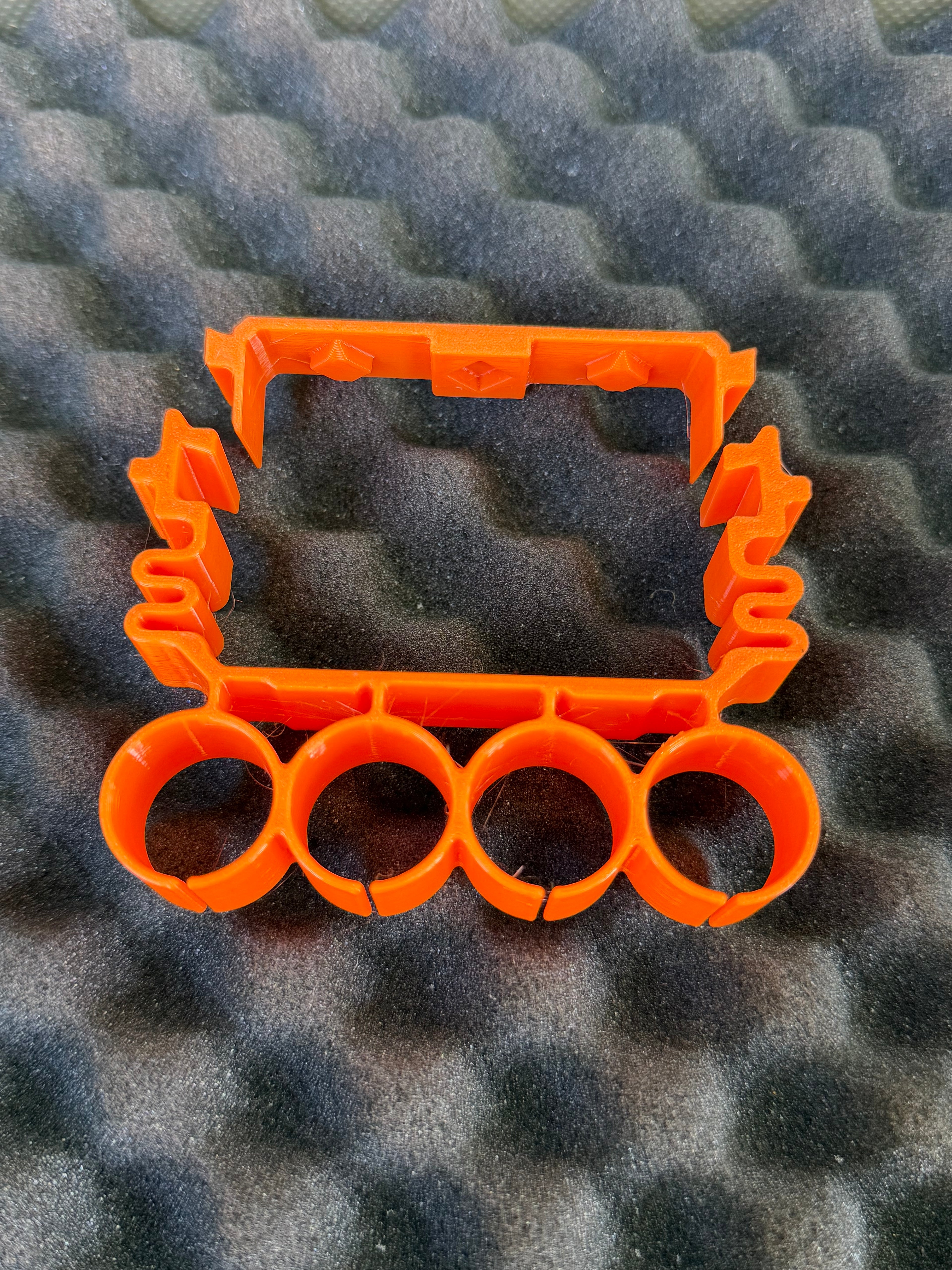 Quad holder for shotshell carriers (Cal 12)