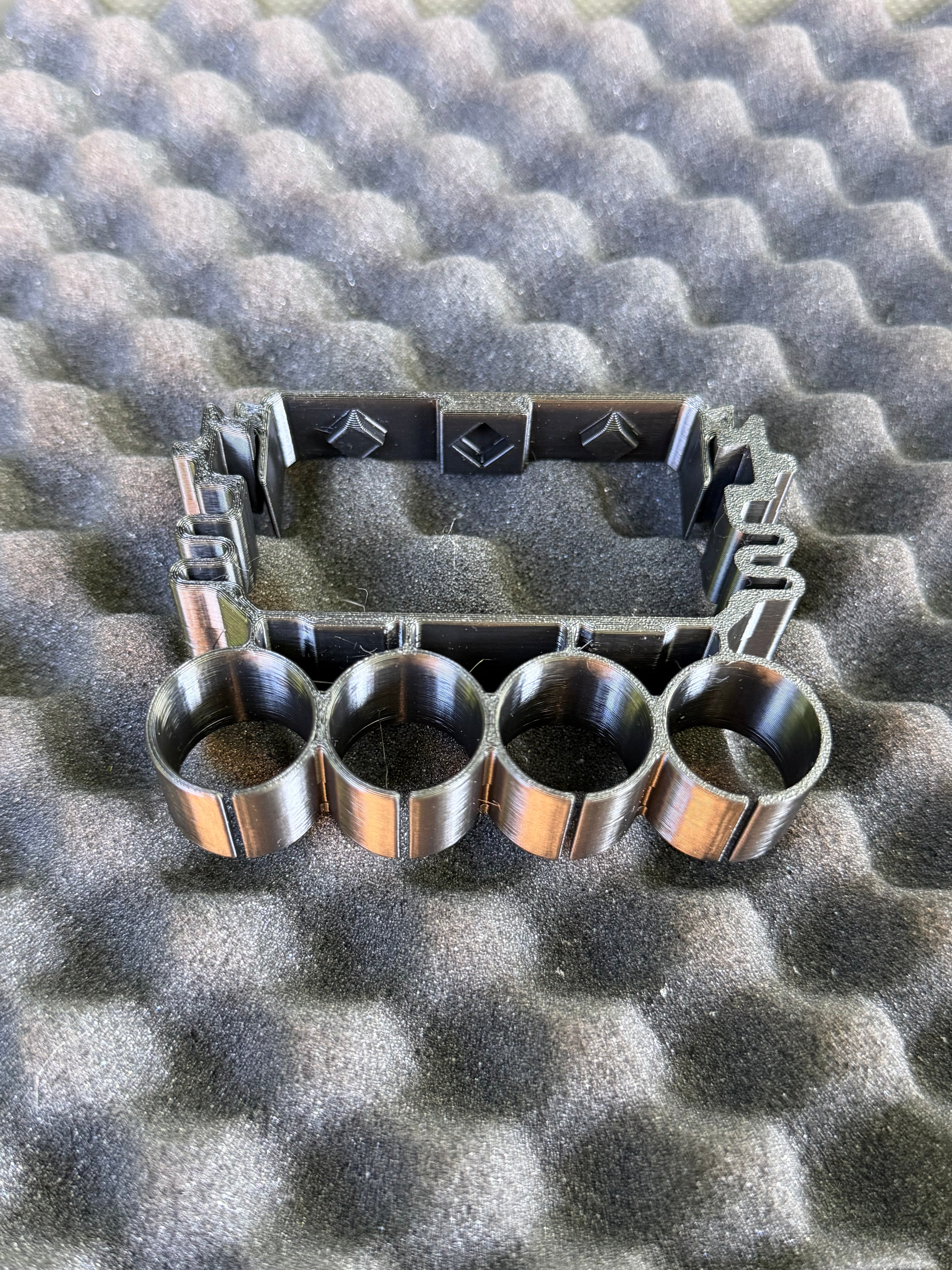 Quad holder for shotshell carriers (Cal 12)